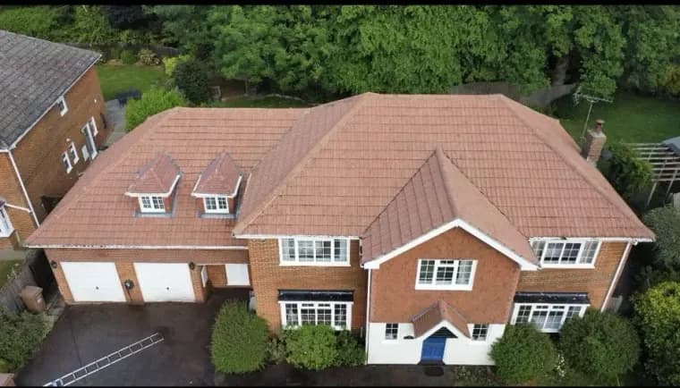 Large detached house roof after cleaning