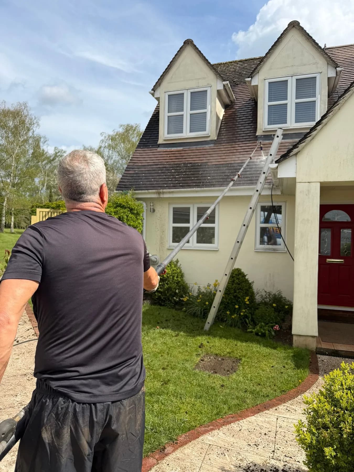 Terry cleaning a dormer bungalow roof