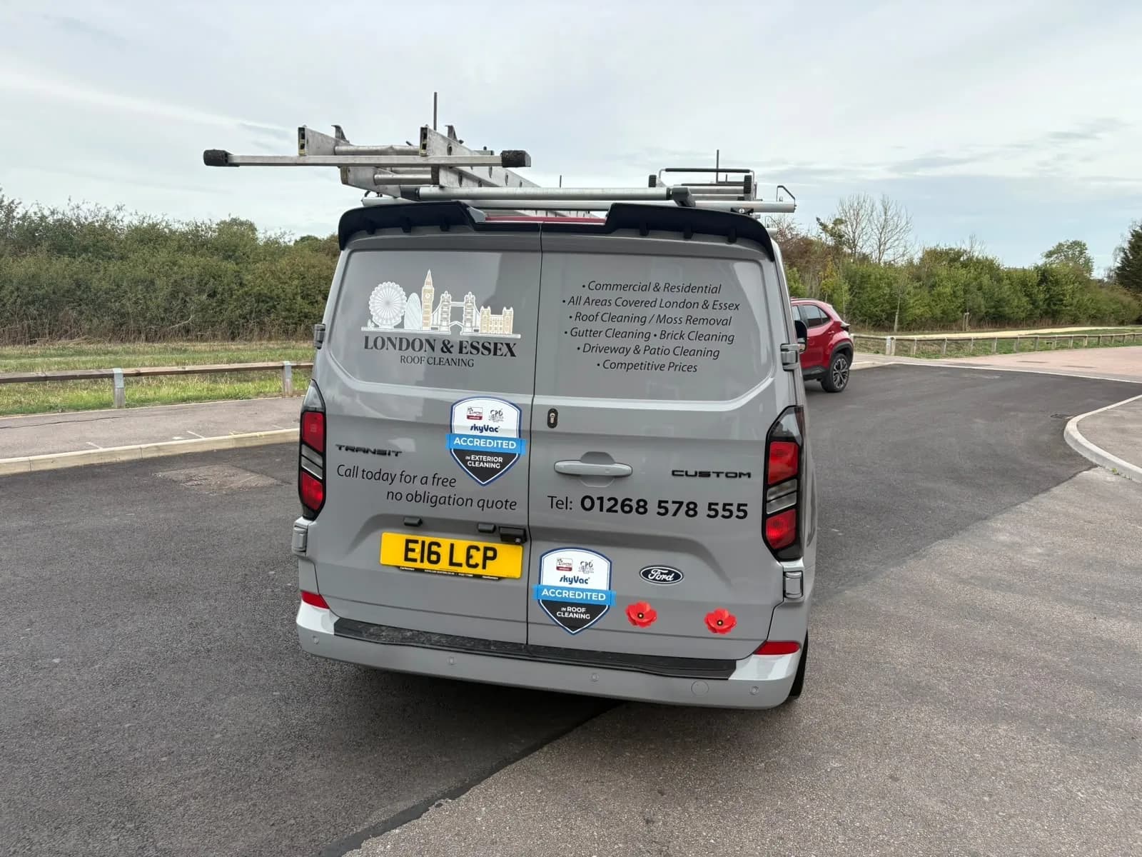 Back of the van showing SkyVac Accredited badges for roof cleaning and exterior cleaning